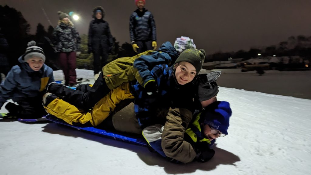 Kids piled on sled